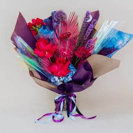 bright blooms, purples, blues and texture all wrapped into a fun bouquet.
